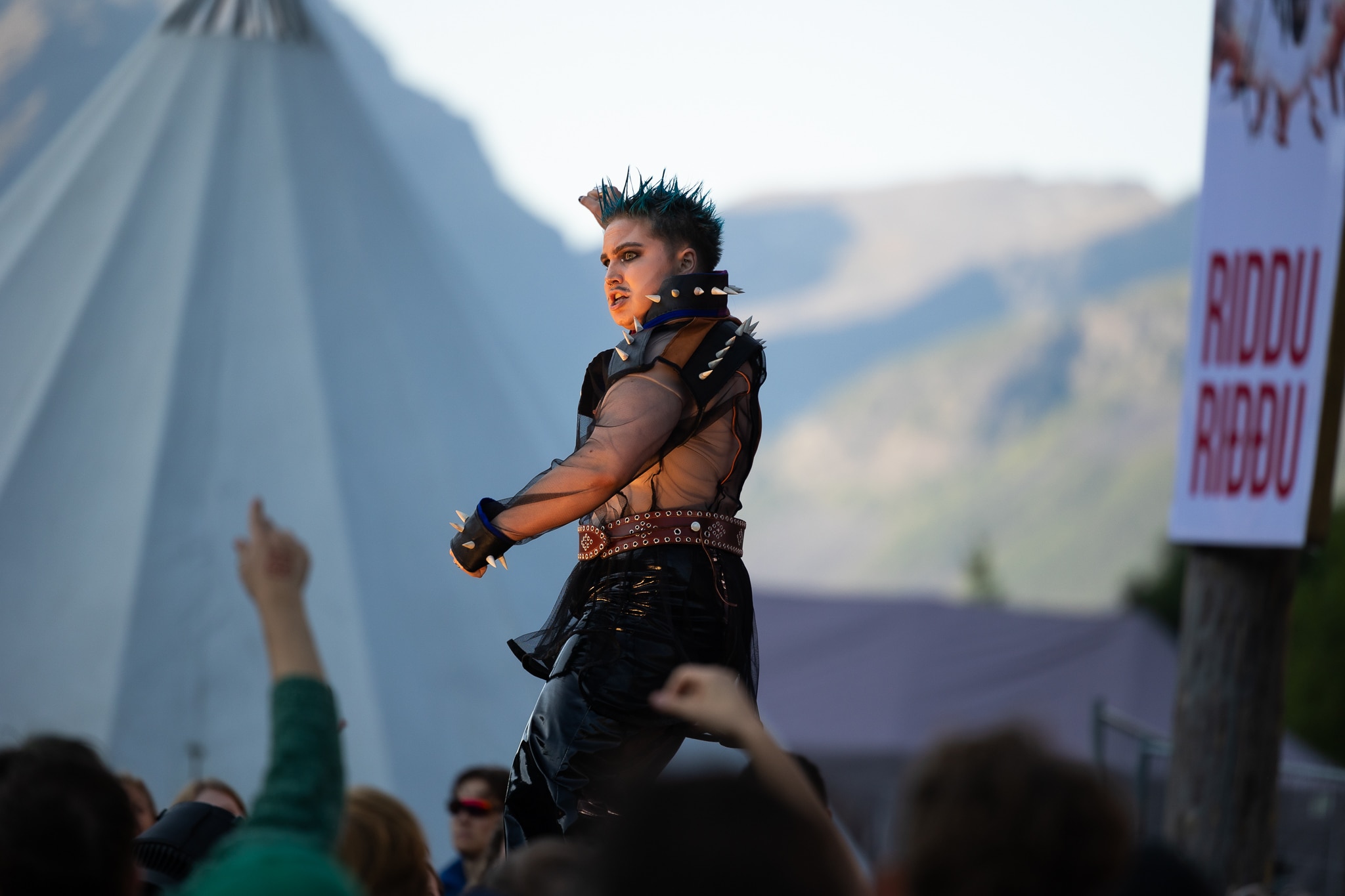 A Sami drag artist on stage in front of an audience.