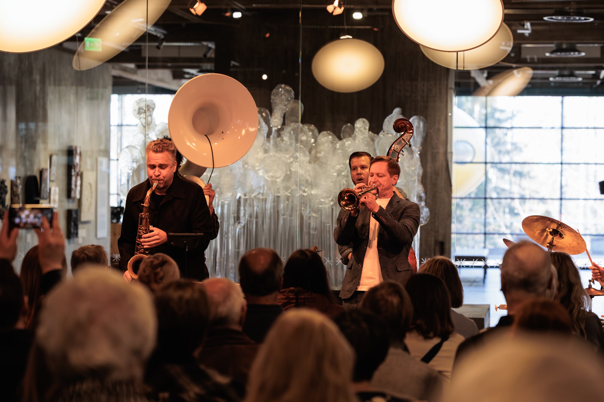 Jazz band performing on stage with audience in front
